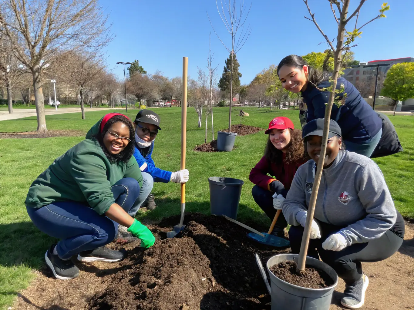 Volunteers working together on a conservation project, such as clearing invasive species or planting native plants in a local park.